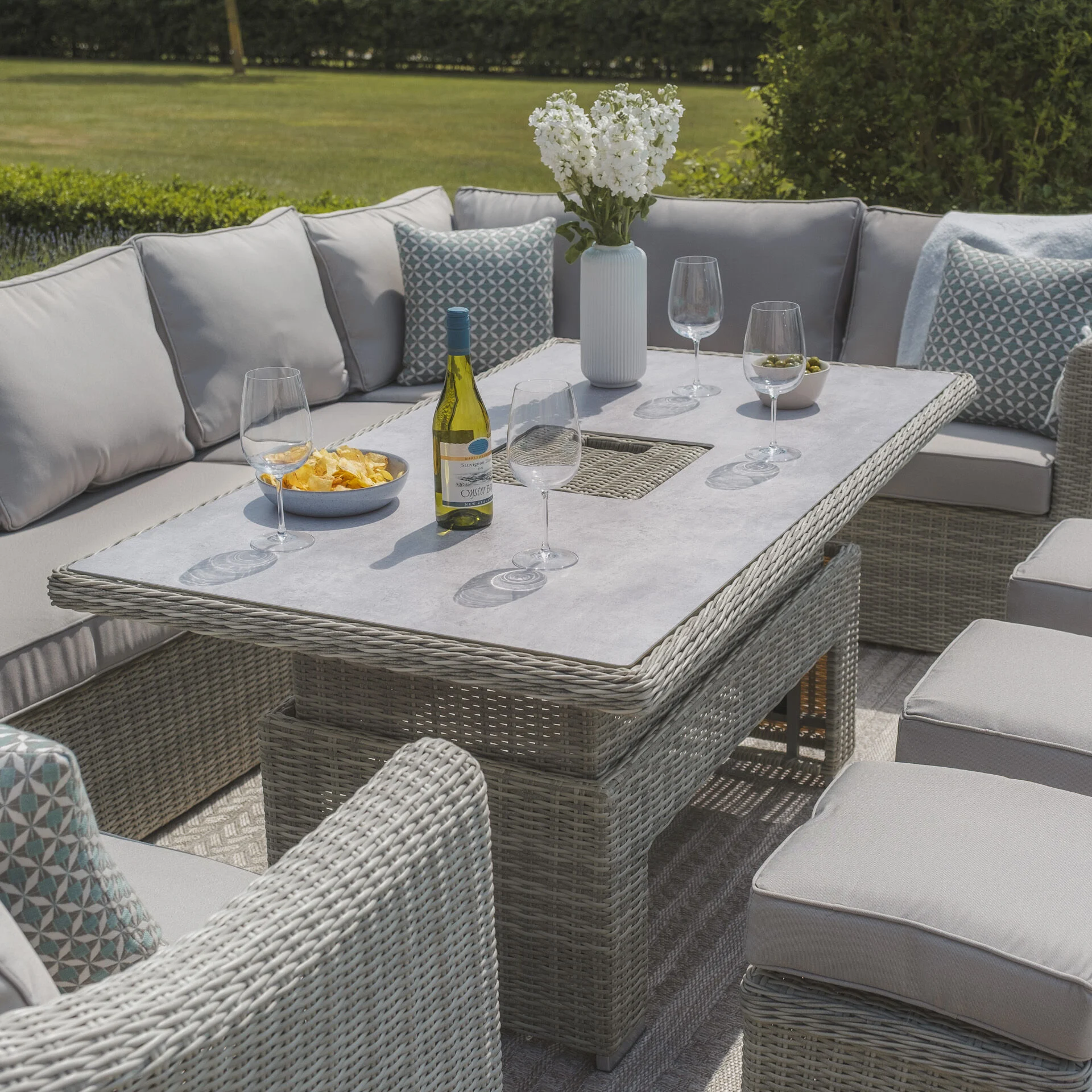 A Oxford Deluxe Large Rattan Corner Dining Set with Rising Table & Armchair - Ceramic Glass - Image 13