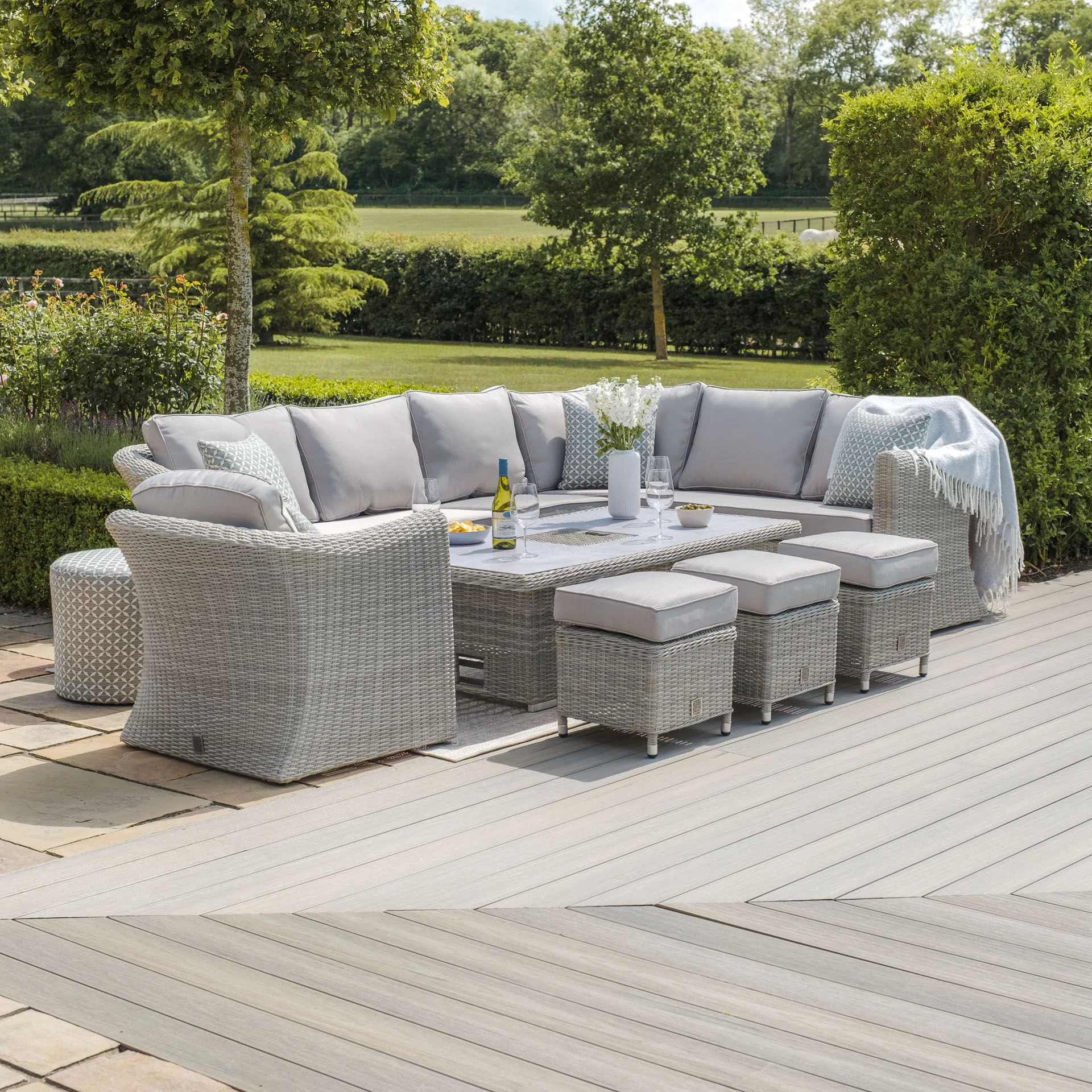 A Oxford Deluxe Large Rattan Corner Dining Set with Rising Table & Armchair - Ceramic Glass - Image 4